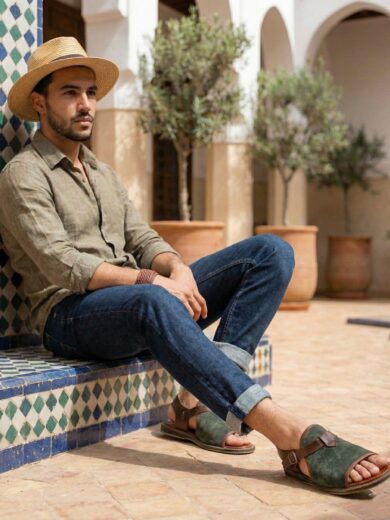 The Pasha brown Men's Strap Leather Sandals displayed in a sunny Moroccan setting.