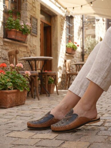 Pair of Zahra Blue Moroccan Leather Slippers showing the Berber cut-out design.