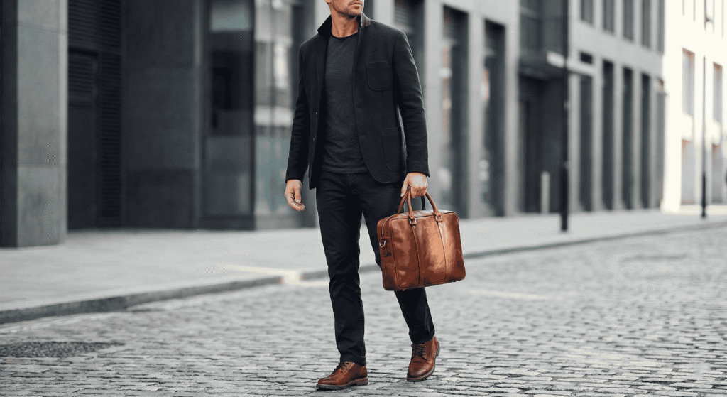 Man wearing minimalist outfit with Kasba Leather briefcase and quality basics
