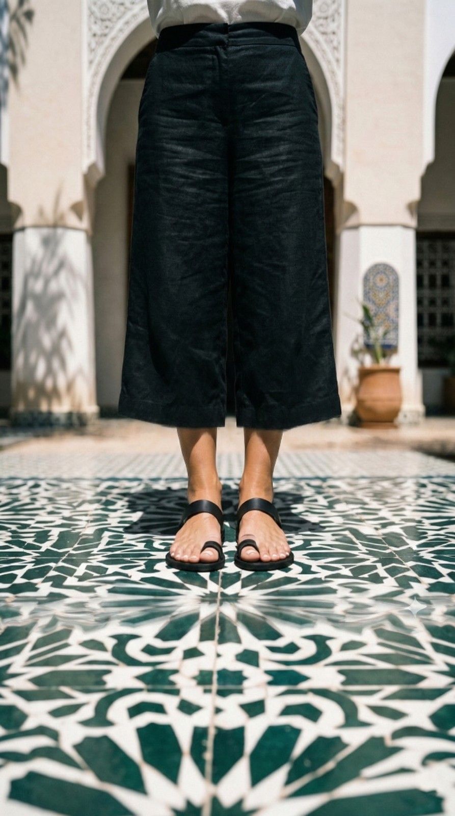 Woman wearing black toe ring sandals on Moroccan star tile — The Essaouira by Kasba Leather